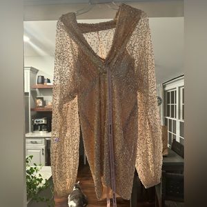 Beautiful champagne colored party dress with sleeves.Never worn, tags still on.